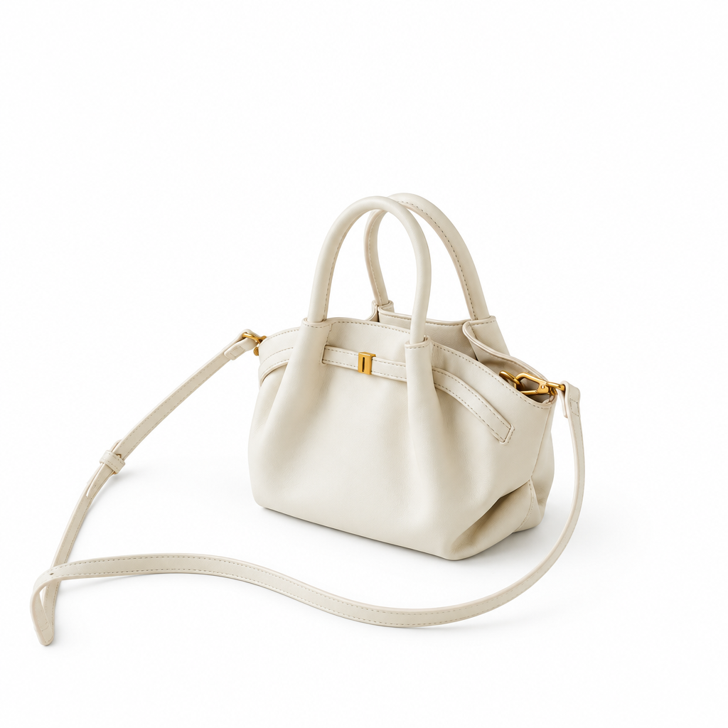 Cream handbag on white background