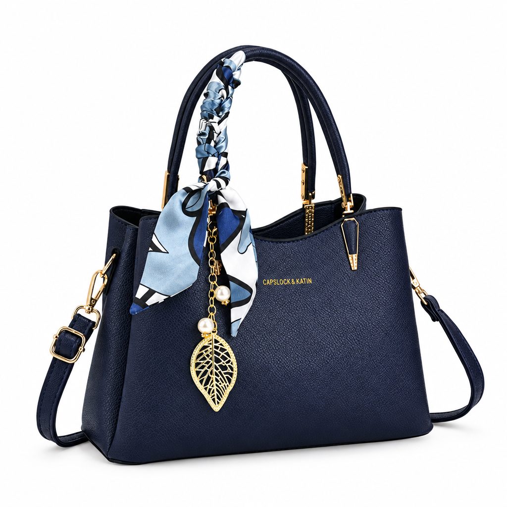 Navy handbag with scarf and charm on white background